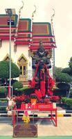 Bangkok, Thailand - March 3, 2024 Statue of Thao Wessuwan for worship and faith in sacredness with ancient church in Thai temples. Religion, Landmark for travel and Exterior design in Asia style. photo