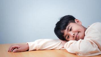 The boy was sitting and thinking about various stories, analyzing and sorting things out. photo