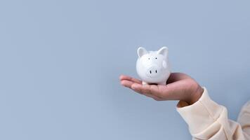 A boy holding piggy bank. Learning financial responsibility and projecting savings. savings concept. investment concept. photo