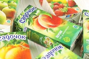 KHARKIV, UKRAINE - JANUARY 2, 2021 Sadochok various taste nectar from peach, apple and strawberry with orange flavour juice photo