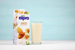 KHARKIV, UKRAINE - JANUARY 2, 2021 Alpro almond vegetarian milk pack produced by European company based in Wevelgem photo