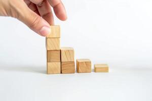 AI generated Hand Holding Wooden Cubes Isolated on White Background photo