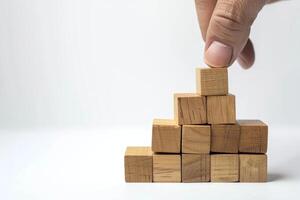 AI generated Wooden Cubes Held by Hand Isolated on White Background photo