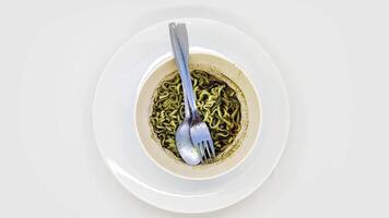 spinning or display rotating of a bowl of rawon flavored instant noodles with black sauce isolated on white background video