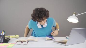 Fun young man is sitting at the lesson. video