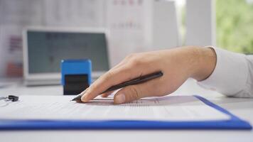 Businessman reading business documents, signing and sealing. video