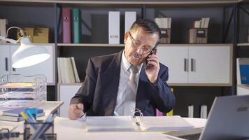 Positive businessman on phone call. video