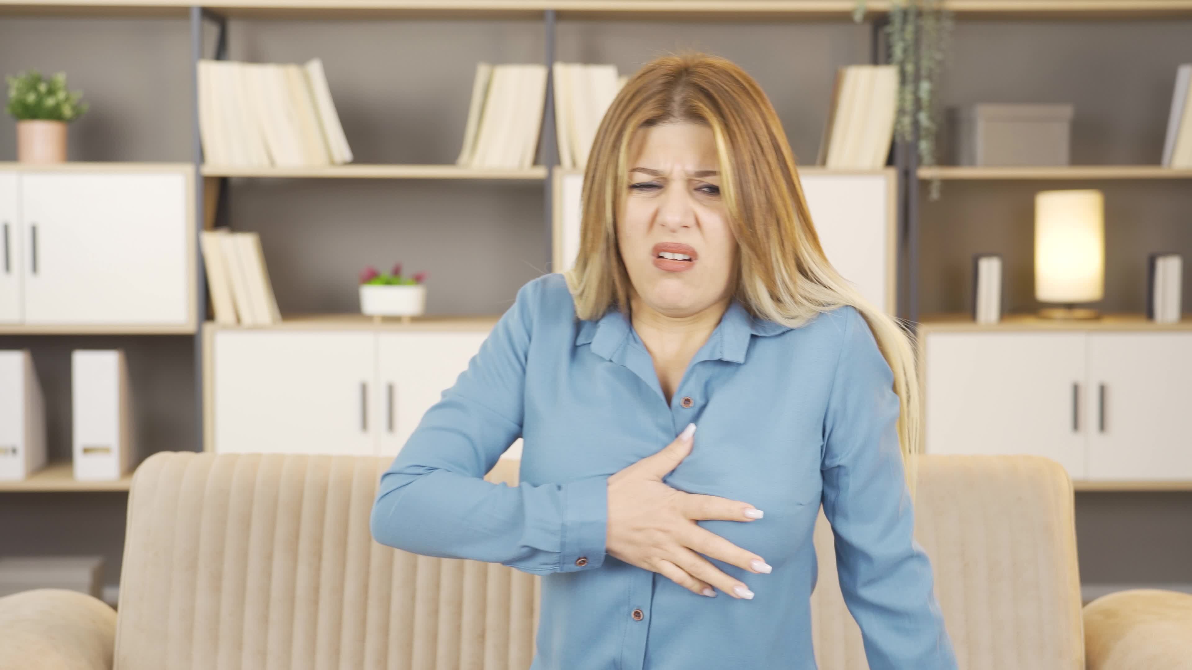 Woman having heart attack 42574828 stock video at vecteezy