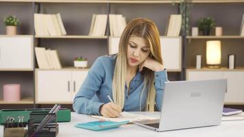 Businesswoman using calculator. video