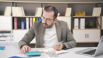 Office worker doing financial calculations. video