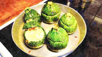 zucchini stuffed with bulgur, cheese and raisins. Ready to be baked photo