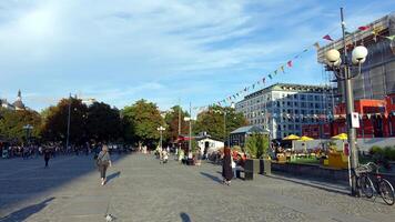 walking in the historic center of Stockholm. You can see the construction site cranes and a hot air balloon. photo