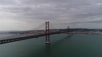 Aerial View Traffic in 25 de Abril Bridge over the River Tejo. Lisbon, Portugal video