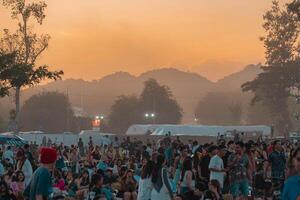 Korat, Thailand, 2023 - People having fun at outdoor music festival. photo