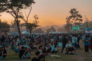 Korat, Thailand, 2023 - People having fun at outdoor music festival. photo