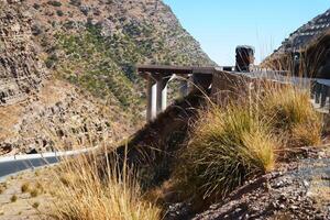 a road in the mountain , this road is known as quetta road, rakhi gaj steel bridge is famous in the world its a new wonder in constriction in Pakistan on 2023-09-25 photo