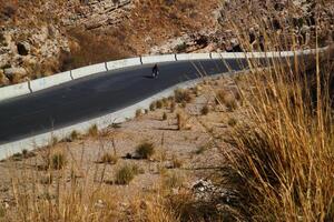 a road in the mountain , this road is known as quetta road, rakhi gaj steel bridge is famous in the world its a new wonder in constriction in Pakistan on 2023-09-25 photo