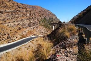 a road in the mountain , this road is known as quetta road, rakhi gaj steel bridge is famous in the world its a new wonder in constriction in Pakistan on 2023-09-25 photo