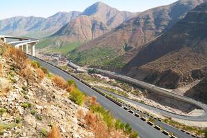 a road in the mountain , this road is known as quetta road, rakhi gaj steel bridge is famous in the world its a new wonder in constriction in Pakistan on 2023-09-25 photo