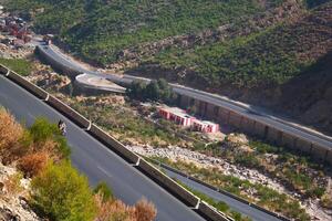 a road in the mountain , this road is known as quetta road, rakhi gaj steel bridge is famous in the world its a new wonder in constriction in Pakistan on 2023-09-25 photo