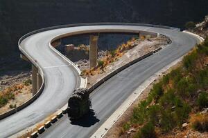 a road in the mountain , this road is known as quetta road, rakhi gaj steel bridge is famous in the world its a new wonder in constriction in Pakistan on 2023-09-25 photo