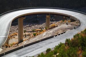 a road in the mountain , this road is known as quetta road, rakhi gaj steel bridge is famous in the world its a new wonder in constriction in Pakistan on 2023-09-25 photo