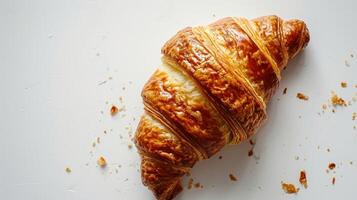 AI generated Top down shot of a golden flaky Croissant on a clean white background photo