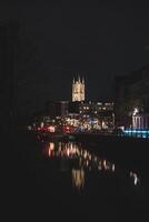 Evening city centre of Ghent in the Flanders region, Belgium. View of the Belfry of Ghent. The very famous towers that are landmarks of Gante photo