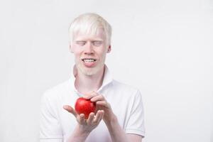 albinism albino man in  studio dressed t-shirt isolated on a white background. abnormal deviations. unusual appearance photo