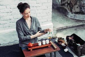 Traditional accessories for tea ceremony, black tea, green tea, oolong, puer, and chaban. Oriental beveradges. Calm meditation concept photo