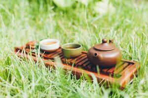 Chinese tea ceremony Asian wooden table board chaban top view copy space morning energy. photo