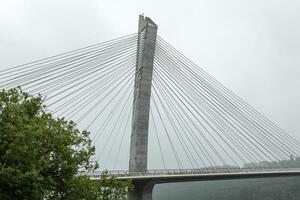 View of a cable-stayed bridge Pont de Terenez in France on a sunny summer morning photo