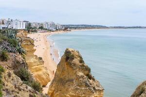 Armacao de Pera Algarve Portugal. Beautiful view on Atlantic ocean at day time and city photo