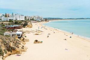 Armacao de Pera Algarve Portugal. Beautiful view on Atlantic ocean at day time and city photo