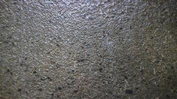 a close up of a concrete wall with some small spots photo