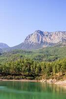 Aerial view of the relaxing and scenic Doyran Pond and surrounding beautiful mountains. Antalya, Turkey. photo