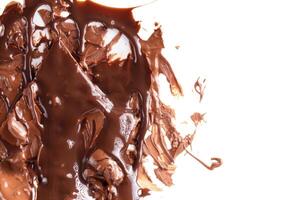 Sweet melted chocolate background with empty space for text.Mass of chocolate. photo