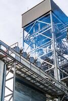 HIgh steel structure at granary. Special construction built near tanks with wheat. Closeup. photo