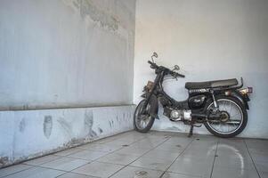 an old classic black Suzuki Family Deluxe motorbike, Indonesia, 2 October 2023. photo