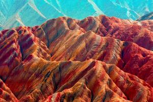 Amazing scenery of china mountains and blue sky background in sunset. Zhangye Danxia National Geopark, Gansu, China. Colorful landscape, rainbow hills, unusual colored rocks, sandstone erosion photo