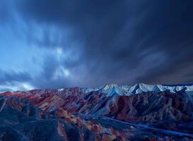 Amazing scenery of china mountains and blue sky background in sunset. Zhangye Danxia National Geopark, Gansu, China. Colorful landscape, rainbow hills, unusual colored rocks, sandstone erosion photo