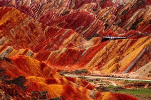 Amazing scenery of china mountains and blue sky background in sunset. Zhangye Danxia National Geopark, Gansu, China. Colorful landscape, rainbow hills, unusual colored rocks, sandstone erosion photo