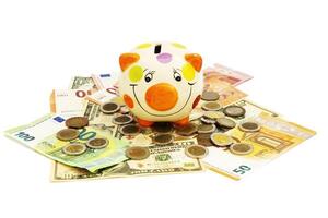 Piggybank and money tower , to save , saving money for affordable things, financial concept .Piggybank or deposit box on a white background, depict saving money to make a trust fund for children photo