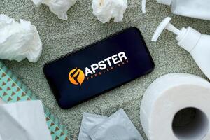 KYIV, UKRAINE - JANUARY 23, 2024 Fapster adult content website logo on display of iPhone 12 Pro photo