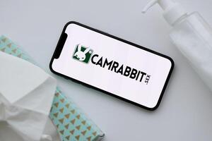 KYIV, UKRAINE - JANUARY 23, 2024 CamRabbit adult content website logo on display of iPhone 12 Pro photo