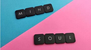 The wordMind Soul written in black letters on a pink and blue background photo