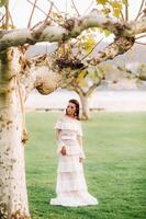 Bride in white wedding dress in the old town of Velden am w rthersee.Model in a wedding dress in Austria.Alps photo