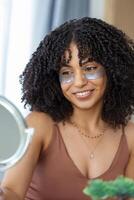 Eye skin care.Woman with beauty patch mask under eyes portrait. photo