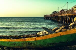 Sunset in front of the beach of the city of La Ceiba, next to the Reynaldo Canales dock, Honduras. photo