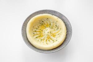 Mashed Potato served in a dish isolated on grey background top view photo